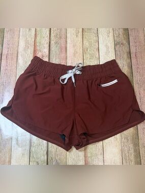 Vuori Women's Athletic Shorts in Burgundy with White Drawstring